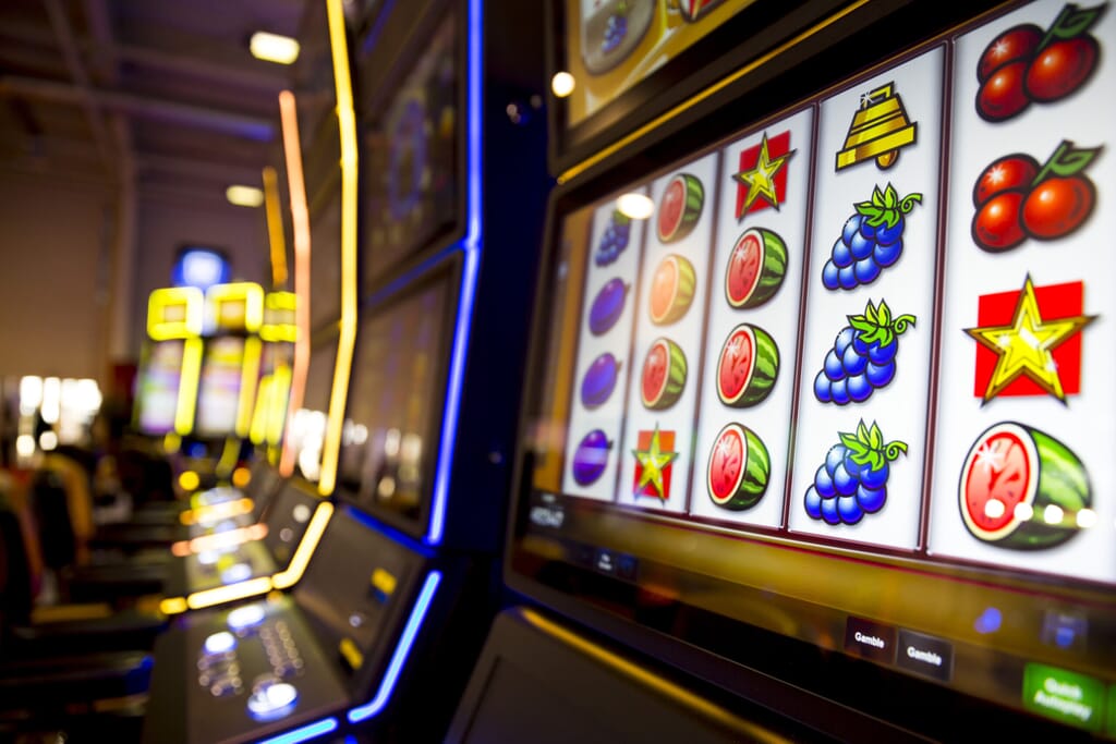 Computer monitor of slot machines in casino equipment exhibition. Fruits.