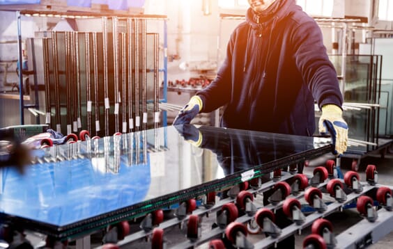 Conveyor belt for production a window pane. Industrial equipment. In-house glass production image - Javelin Displays